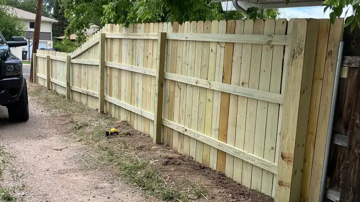 New pressure-treated fence